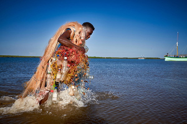 Identifying management opportunities to combat climate, land, and marine threats across less climate exposed coral reefs